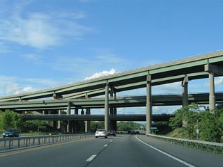 There are two other four-level interchanges of similar design in New York State. The exchange joining I-90 with U.S. 9 to the immediate west is one. The other is where I-295 meets Grand Central Parkway in Queens, New York.