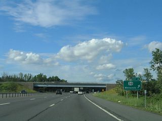 NY 32 (Broadway) runs south to North Albany and north through Menands to Watervliet.