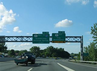 Signage for Exit 9 E originally directed Interstate 787 northbound onto NY 7 east across the Hudson River.