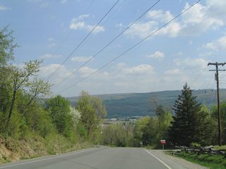 CR 9 (Ossian Hill Road) descends steeply from 1,050 feet in elevation at CR 49 to 650 feet at NY 436 (Nunda-Dansville Road).
