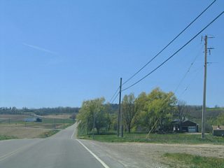 Approaching the intersection with CR 49 (McCurdy Road) south. Leading southward to Canaseraga Road, CR 49 is unmarked from Ossian Hill Road.