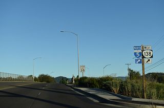 Garden Valley Boulevard meets I-5/OR 138 at a six-ramp parclo interchange (Exit 125) west at Mulholland Drive in Roseburg.
