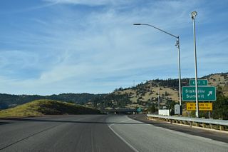 Old Highway 99 S (OR 273) follows a winding course 5.5 miles north through Siskiyou Pass and Siskiyou Summit, returning to I-5 at Exit 6.