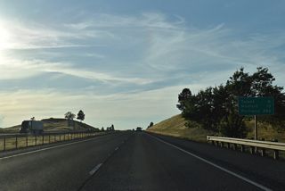 Paralleling Bear Creek, continues on a northwest course 5.6 miles to Talent. The freeway serves as a buffer between urban areas of Ashland and rural farmland to the north.