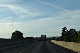 A four lane viaduct takes Interstate 5 across Bear Creek from E 12th Street north to E Jackson Street east of Downtown Medford.