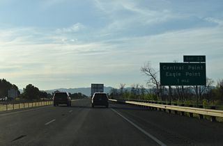Pine Street arcs 0.8 miles east from OR 99 (Front Street) through Downtown Central Point to the diamond interchange at Exit 33. Eagle Point is a city nine miles to the northeast along OR 62.