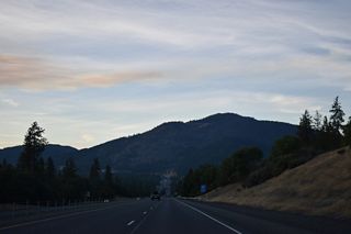 Interstate 5 passes Red Mountain before circumventing Sexton Mountain north ahead of Sexton Mountain Pass.