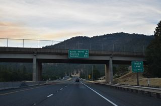 A truck climbing lane opens north of Monument Drive as Interstate 5 gains 765 feet in elevation to Sexton Mountain Pass.