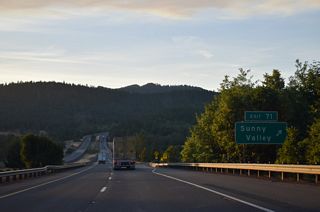 A folded diamond interchange joins I-5 with Lariat Drive / Sunny Valley Loop at Exit 71. The community of Sunny Valley was named such as "the sun always shines on the meadows and creeks" ("Sunny Valley Oregon Profile", n.d.).