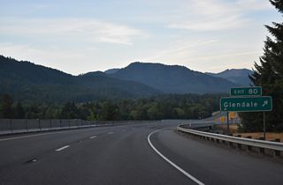 Glendale Valley Road heads 2.4 miles west to Sether Avenue in the city of Glendale. Junction Road runs 0.6 miles north to Old Pacific Highway (CR 12) and Azalea-Glen Road at Glendale Junction.