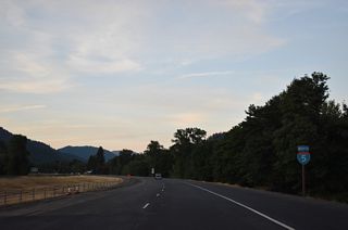 Interstate 5 crosses Cow Creek ahead of this confirming marker preceding milepost 87.