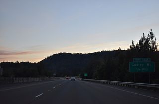 Interstate 5 crosses the South Umpqua River for the first time before curving north into a diamond interchange (Exit 102) with Gazley Road.