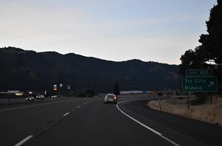 Gael Lane links the parclo interchange at Exit 103 with Old Pacific Highway (OR 99) 0.3 miles to the east. Pruner Road leads west from Interstate 5 to become Riddle Bypass Road south to Main Street in Riddle.