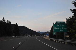 I-5 crosses the South Umpqua River again ahead of Myrtle Creek Municipal Airport (16S) and the diamond interchange (Exit 106) with Weaver Road.