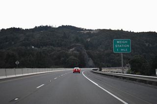 A northbound weigh station operates along Interstate 5 at mile marker 111.