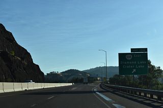 Exit 124 leaves Interstate 5 northbound for OR 138 (Harvard Boulevard) east in Roseburg. Harvard Avenue extends west as a five lane boulevard to Lookingglass Road in southwest Roseburg.