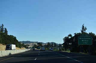 A folded diamond interchange joins I-5/OR 138 with Del Rio Road and OR 99 (Oakland-Shady Highway) north of Winchester and Roseburg North.