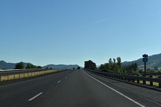 Interstate 5 crosses the Southern Pacific Railroad and Wilson Creek north of this confirming marker preceding milepost 151.