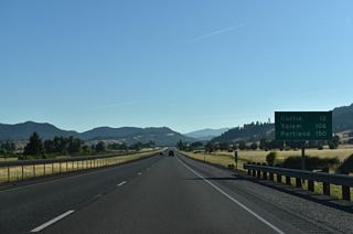 Interstate 5 advances northeast through Pleasant Valley east of Ambrose Hill.