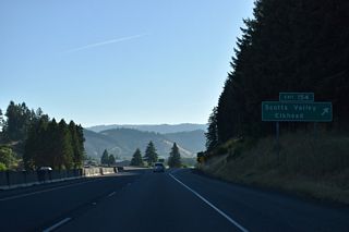 Elkhead Road continues south from Scotts Valley around Dickinson Mountain to the unincorporated community of Elkhead.