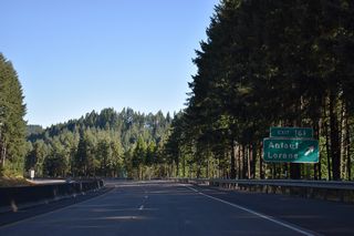 Buck Creek Road west ties into Curtin Road (Old U.S. 99 / CR 212) at Anlauf, 0.4 miles south of Territorial Highway (CR 116). Territorial Highway travels across the adjacent hills north nine miles to the community of Lorane.