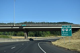 Exit 162 loops onto OR 99 (Umpqua Highway) southbound from Interstate 5 north. OR 38/99 parallel the Southern Pacific Railroad and Pass Creek 7.20 miles southwest to Cedar Street in Drain.
