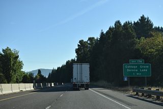 Interstate 5 enters the city of Cottage Grove and next meets the Cottage Grove Connector west and Row River Road south at Exit 174,