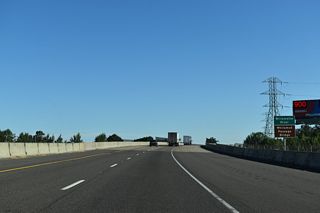 Interstate 5 crosses the Whilamut Passage Bridge with four overall lanes. Built in 1961, the previous bridge over the Willamette River was deemed unsafe for heavy freight traffic by ODOT due to the discovery of shear cracks in 2002 (Federal Highway Administration, 2017).