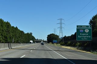 The directional cloverleaf interchange at Exit 194 connects I-5 with I-105/OR 126 west to Downtown Eugene and OR 126 (McKenzie Highway) east across Springfield.