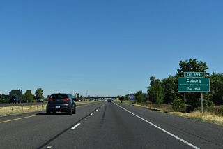 The succeeding exit along I-5 north is for Pearl Street west into Coburg and Van Duyn Road east. Settled in 1847, nearly twelve years before Oregon statehood, Coburg was awarded a National Historic District designation in 1986.