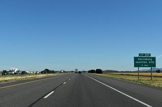 Exit 209 joins I-5 with Diamond Hill Road to Harrisburg and Junction City in one mile.