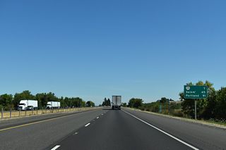 The previous distance sign north of Exit 209 referenced OR 228 at six miles and Albany at 24 miles in place of Salem.