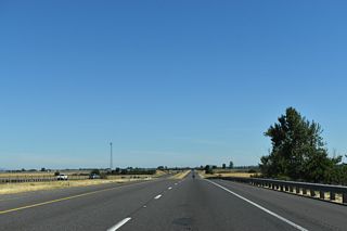 Interstate 5 rises across an abandoned Southern Pacific Railroad corridor west of Bond Butte and south of the Bond Butte Drive over crossing.