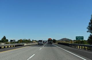 Interstate 5 crosses the Calapooia River on a rural stretch west of the Powell Hills.