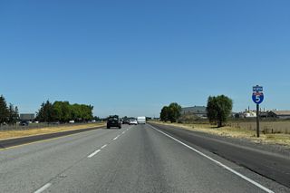 A nearly uninterrupted 30 mile stretch through Oregon farm country concludes at Albany in five miles. Portland is 67 miles further.