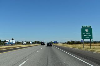 The freeway crosses Albany city limits at milepost 233 just ahead of U.S. 20. Albany was settled in 1848, and in a pattern repeated throughout the state, named for the settlers' hometown - in this case Albany, New York. Officially incorporated in 1864, the city boasts itself to be "the rare metals capitol of the world," with local industries producing zirconium, hafnium, and titanium.