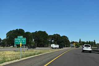 I-5 runs north by Albany Municipal Airport (S12) to Exit 234 for Knox Butte Road. Knox Butte Road connects the freeway with OR 99E (Pacific Boulevard) southwest back into Albany.