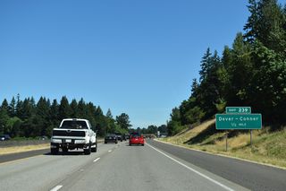 A parclo A2 interchange (Exit 239) joins I-5/OR 99E north next with Dever-Conner Road west and Santiam Bluffs Road east.
