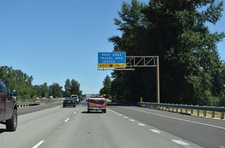 An exit ramp formerly connected Interstate 5 north with parallel Higbee Road. A third northbound lane opens beyond that location to the Santiam River Rest Area.