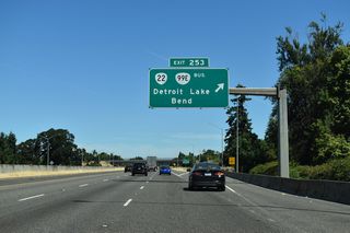 West of the six-ramp parclo interchange at Exit 253, OR 22 (North Santiam Highway) heads into Salem along Mission Street. OR 99E Business loops west to Downtown Salem and north along Salem Parkway, back to I-5/OR 99E at Exit 260 A.