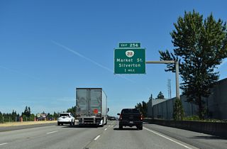 A single point urban interchange (SPUI) joins I-5 with OR 213 (Market Street) 1.25 miles north of State Street.