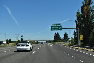 Interstate 5 reaches Exit 263 for Brooklake Road west to Wheatland Road and east to OR 99E (Portland Road) in Brooks.