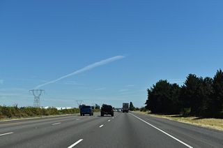 High-voltage transmission lines run along the west side of the freeway almost to Wilsonville.