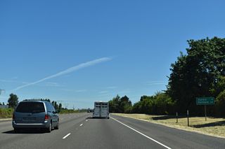 Aurora represents the succeeding exit from I-5 northbound. Portland is 29 miles away.