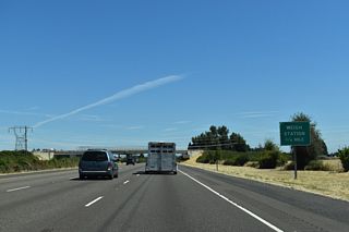 The weigh station north of Woodburn operates with a "green light" weigh-in-motion preclearance site, allowing trucks equipped with certain transponders to bypass the station. This option saves fuel and reduces emissions.