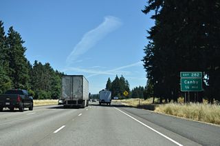 The diamond interchange (Exit 282) with Miley Road lies within the wye interchange bringing traffic northbound from OR 551 (Portland-Hubbard Highway) onto Interstate 5.