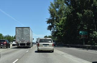 Northbound I-5 crosses the Willamette River over the Boone Bridge.