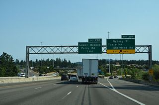 Nyberg Road transitions onto Tualatin-Sherwood Road west from the commercialized stretch at Exit 289. The arterial travels across Tualatin to the city of Sherwood. Like other Portland suburbs, Tualatin grew rapidly from 1980 to 2000, gaining 15,000 residents.