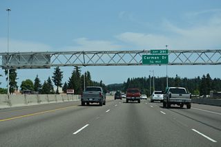 Interstate 5 straddles the east Tigard city line north to the diamond interchange (Exit 291) with Carman Drive and Upper Boones Ferry Road.