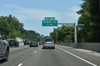 Exit 298 connects Interstate 5 north with Corbett Avenue at South Portland in a half mile. Corbett Avenue leads south to the Corbett-Terwilliger-Lair Hill community and north to the Johns Landing neighborhood.